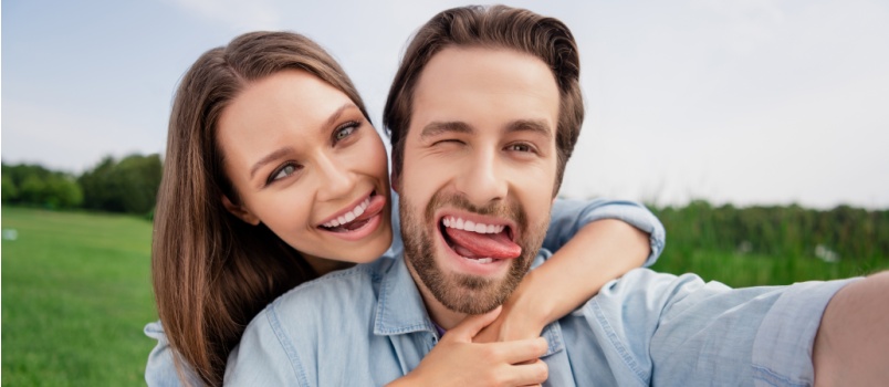 Funny funky couple taking selfie