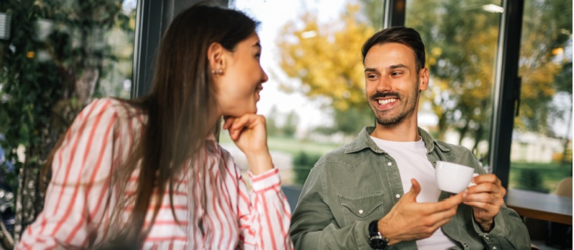 couple enjoying coffee over conversation