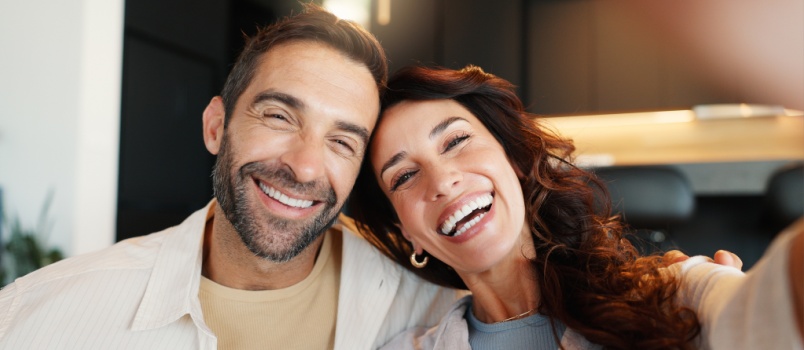 Happy couple taking selfie 