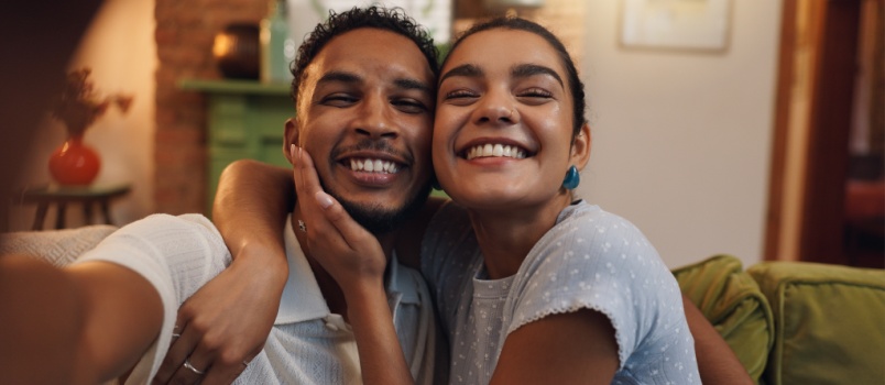 Happy couple taking selfie 