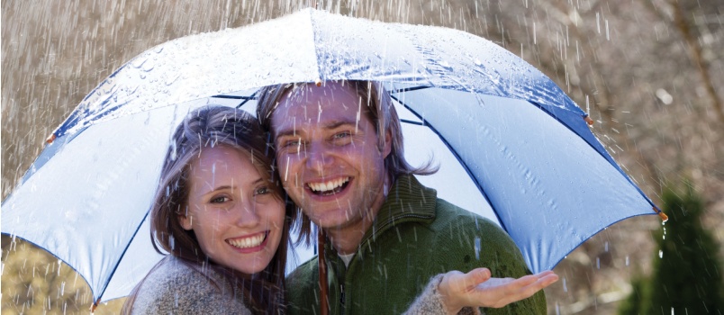 Couple enjoying raining