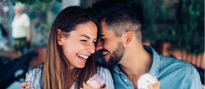 Young loving couple having ice-cream