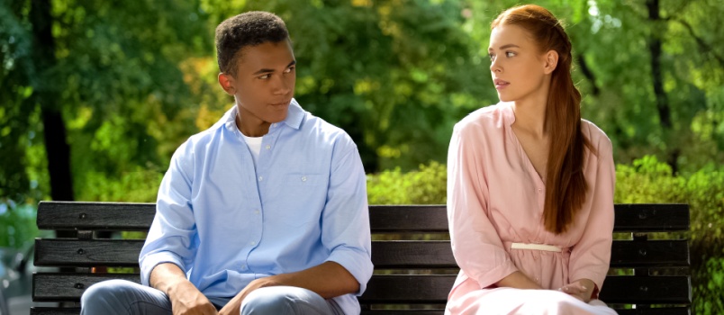 Smiling couple looking at each other