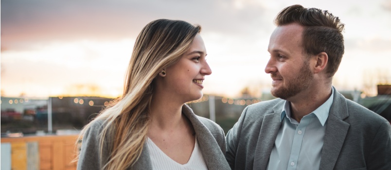 Young industrial couple standing outside