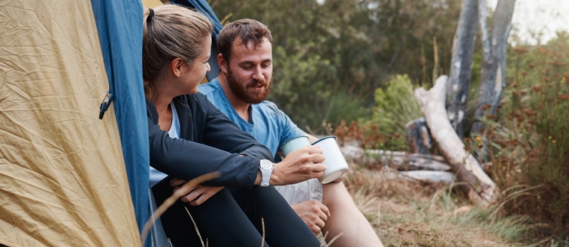 Young couple camping together
