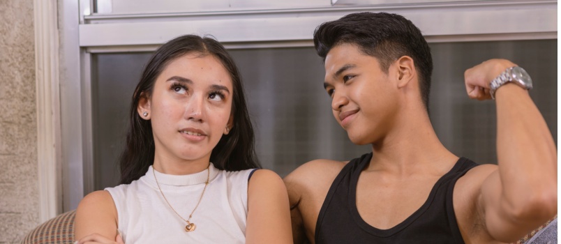 Annoyed woman cringes her husband