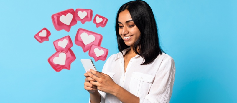 Woman smiling while scrolling the phone