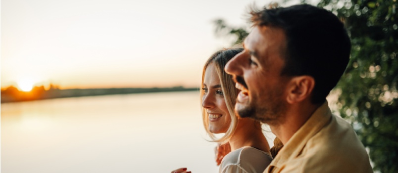 Young love couple stands by tranquil