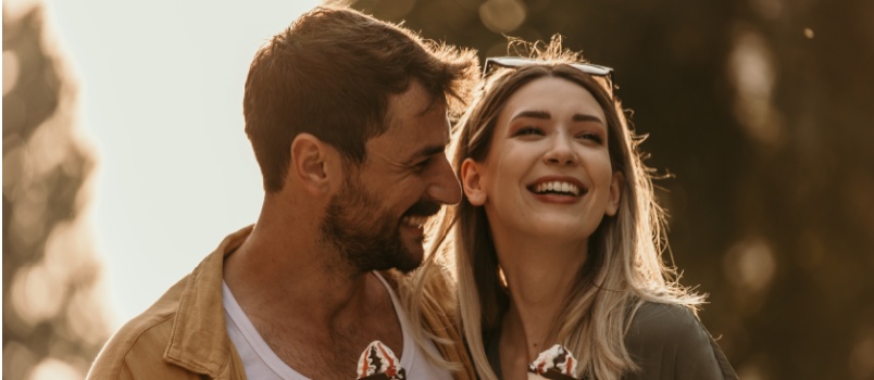 young couple walking on street having ice-cream