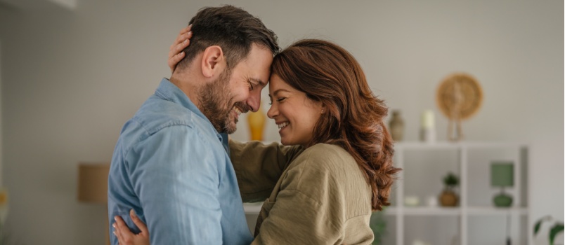 cheerful couple embracing each other