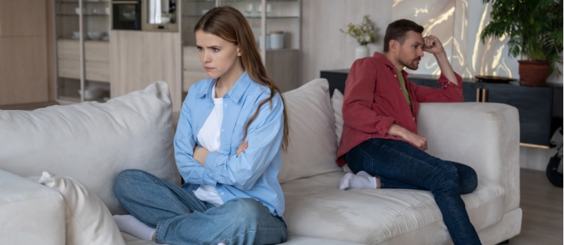 Irritated couple ignoring each other