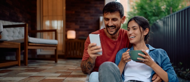 young loving couple using phone