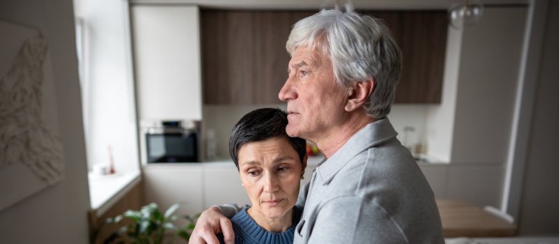 Elderly couple hugging each other