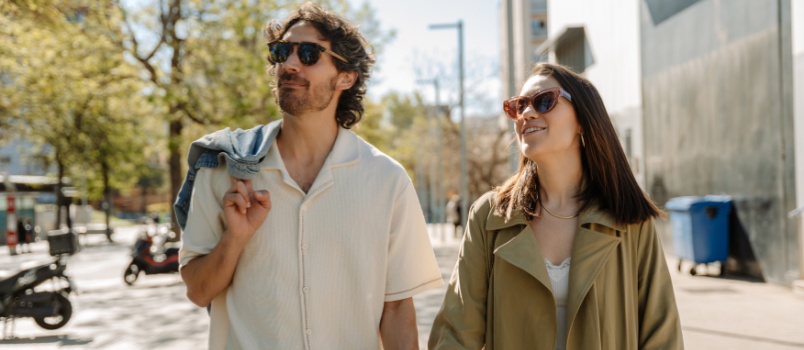Woman walking holding man hand