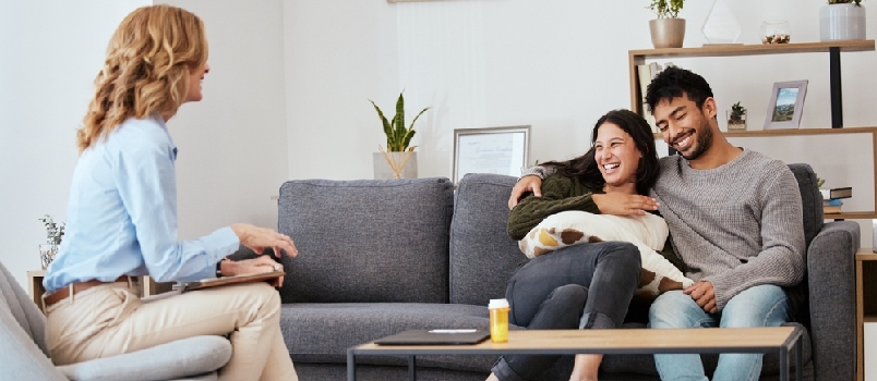 Happy couple taking theraphy session