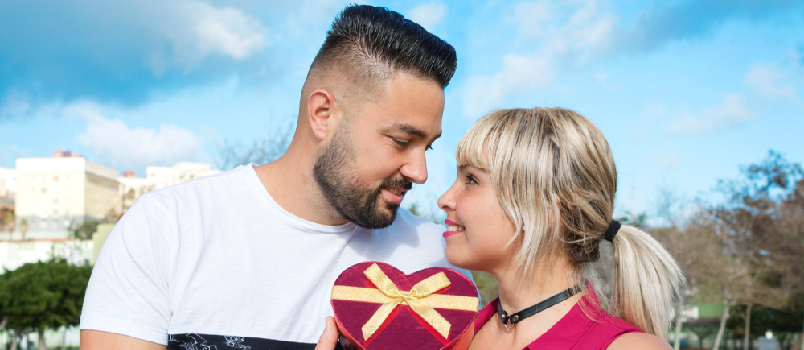 Man giving gifts to woman