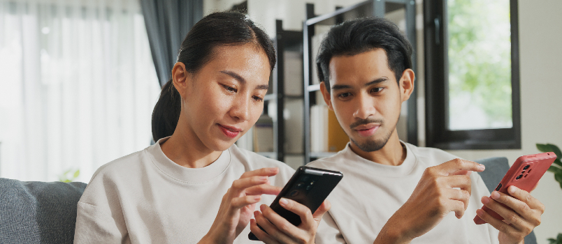 Young Adults Relaxing at Home with Smartphones