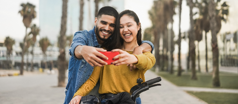 Affectionate Couple Taking a Selfie in the City