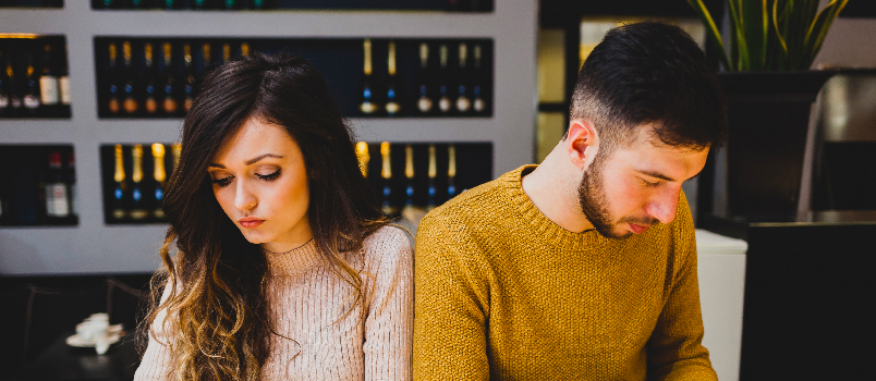 Young Couple with Smartphones in Cafe, Disconnected 