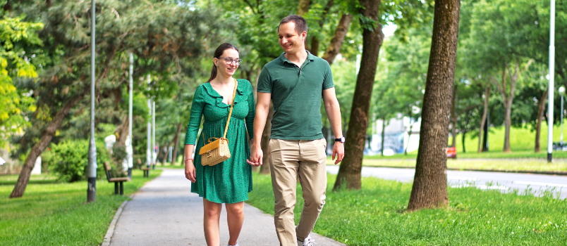 young couple walking dowm the street