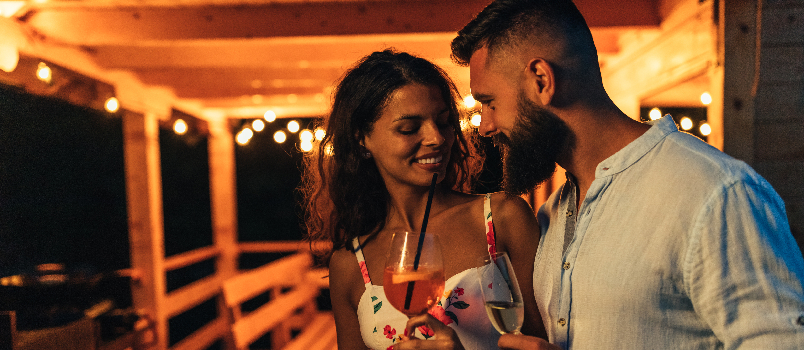 Romantic Couple Enjoying Drinks at an Evening Party