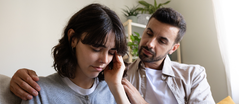 Man comforting woman