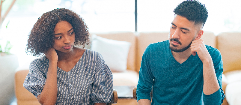 Pensive Man and Woman Sitting at Table